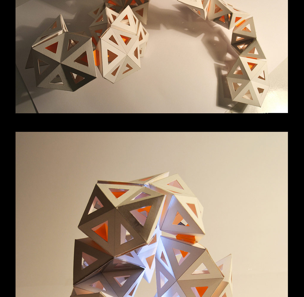 Structure made of several triangules forming different structures - white and orange